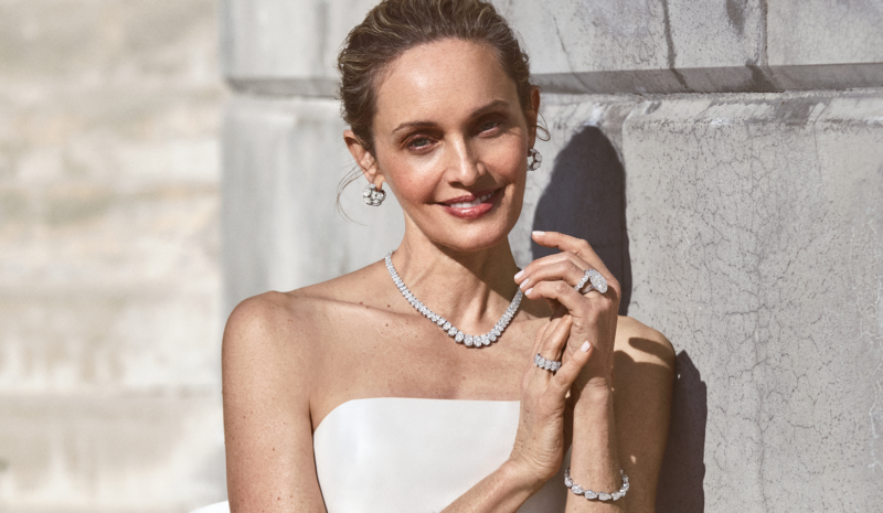 Norman Silverman bridal campaign with a woman in a white dress outdoors.