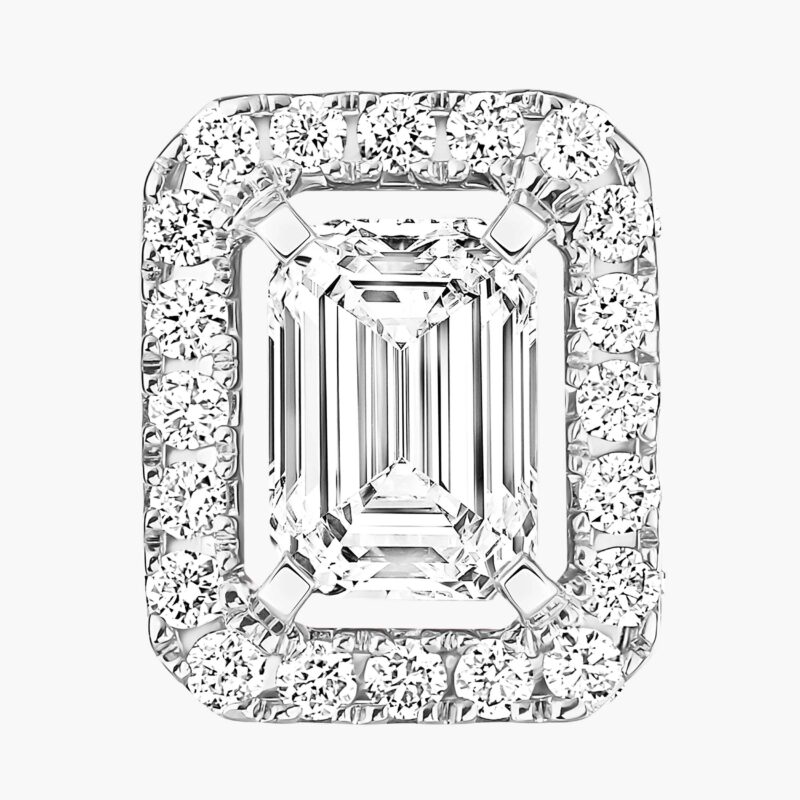Close view of an emerald-cut diamond surrounded by a halo of smaller round diamonds.