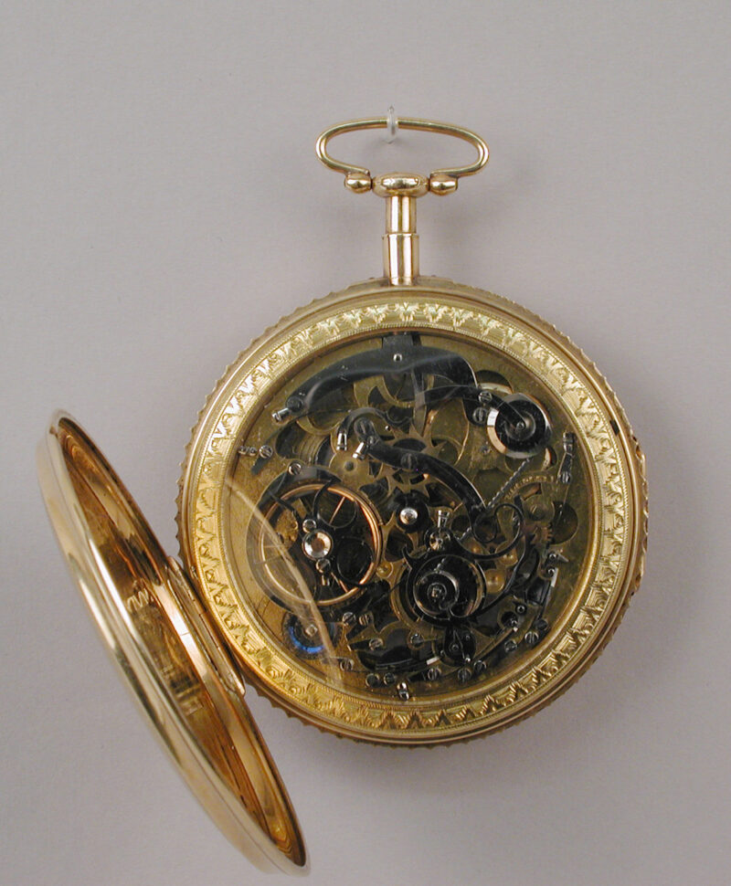 Rear view of the skeleton watch with its mechanism exposed.